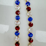 Close-up of the crystal detail and antique gold plated links on the Sofia necklace in 4th of July mix