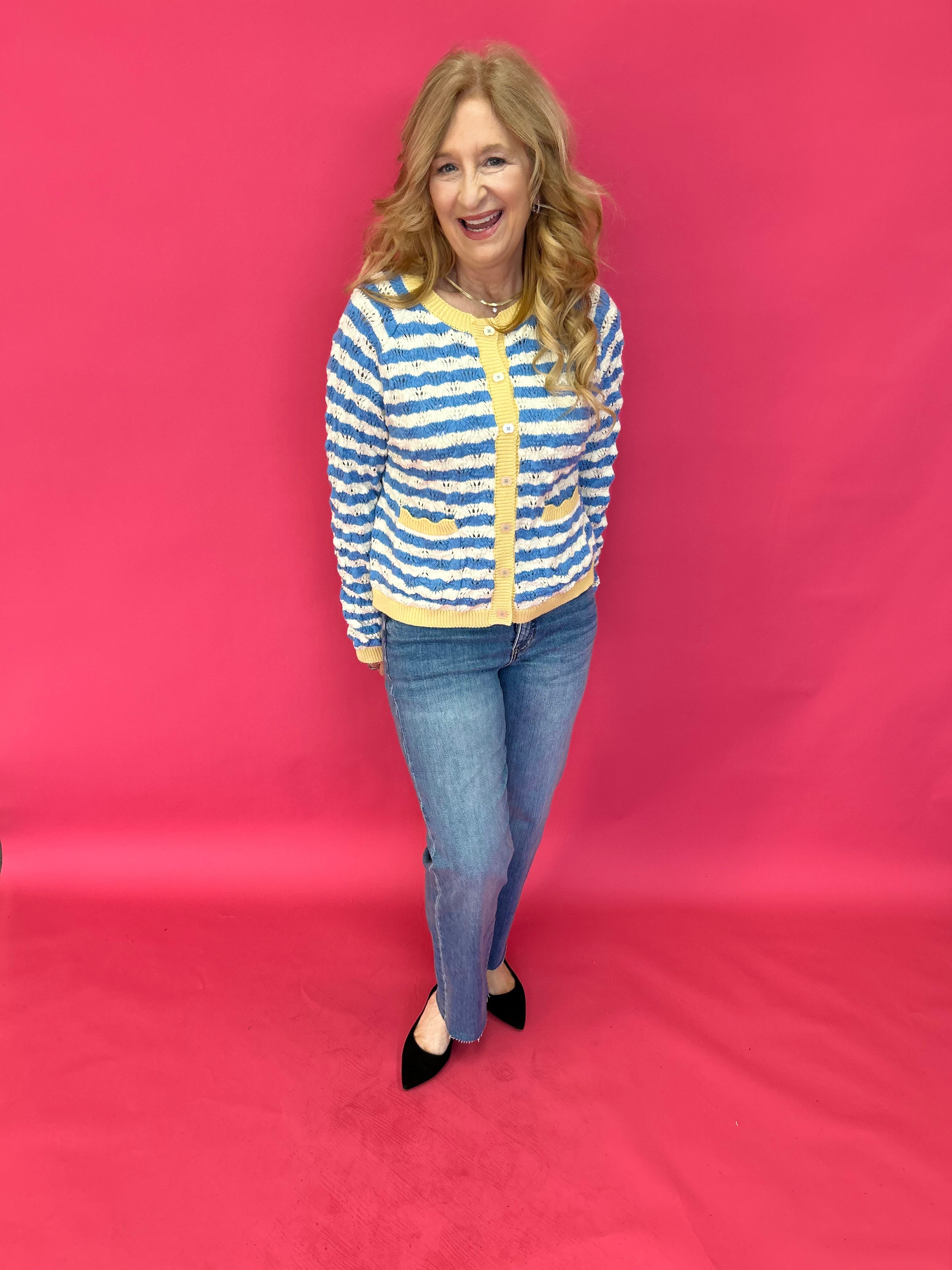 Close-up of the wavy contrast stripe knit texture and neckline on the soft sweater