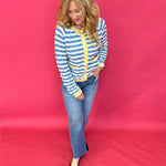 Flat lay of the wavy stripe knit sweater showing the long sleeves and hi low hemline
