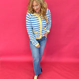 Flat lay of the wavy stripe knit sweater showing the long sleeves and hi low hemline