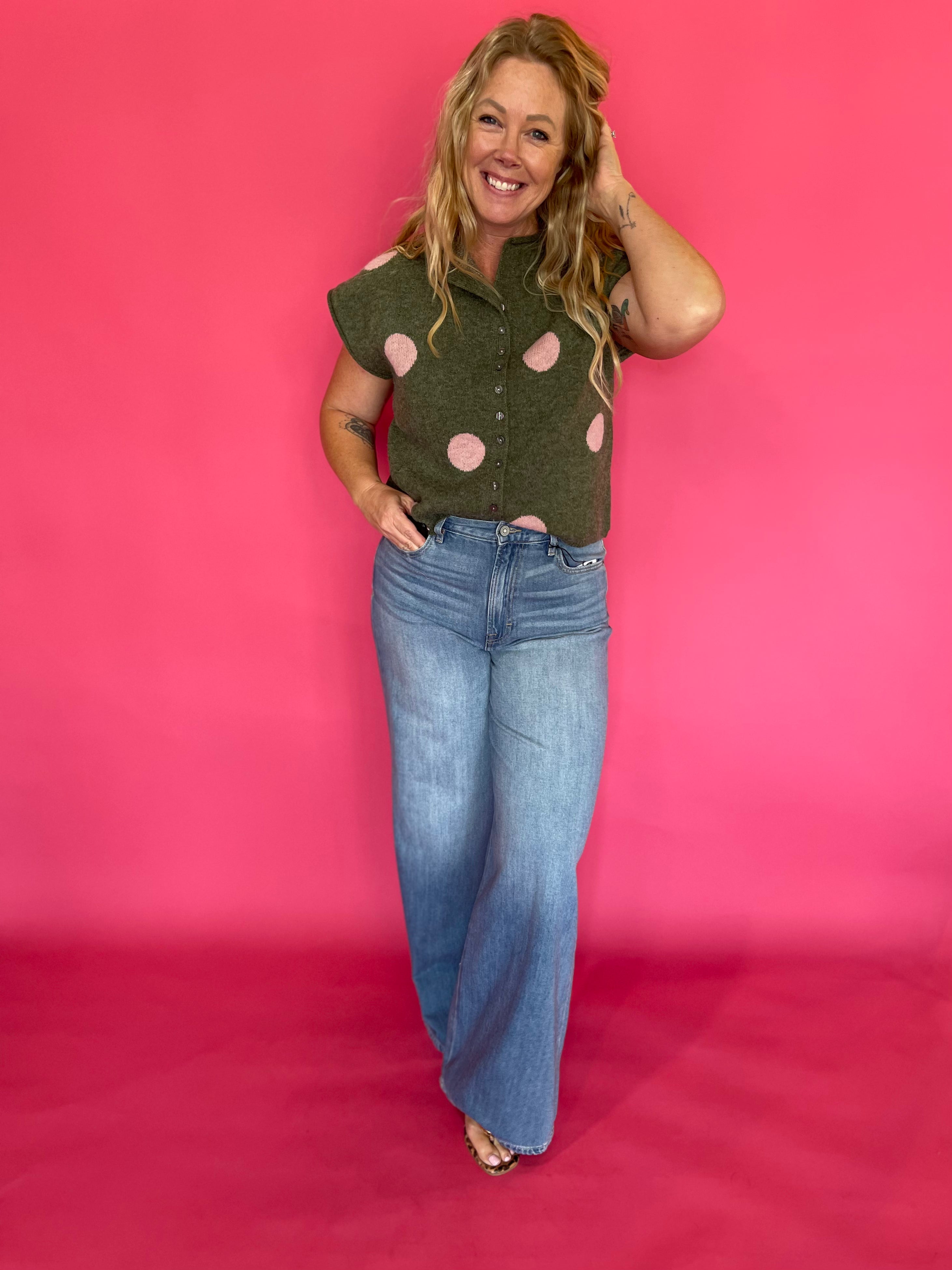 Back view of the cropped olive polka dot sweater top showing the relaxed lightweight knit body