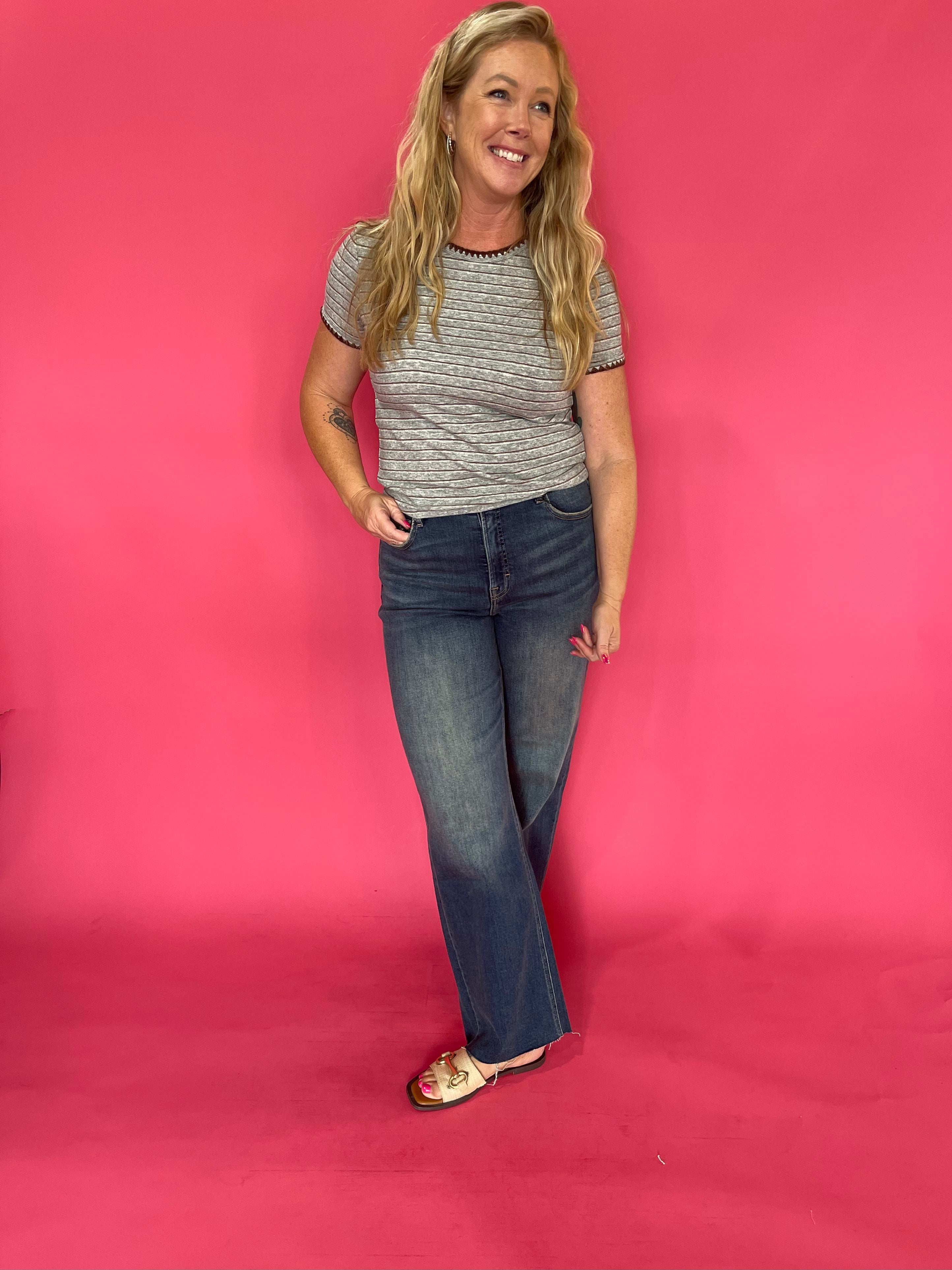 Back view of the grey striped baby tee showing the close fitted body and short sleeve cut