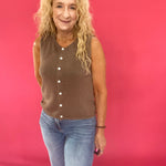 Side view of the sweater vest worn open over a white tee as a lightweight everyday layer
