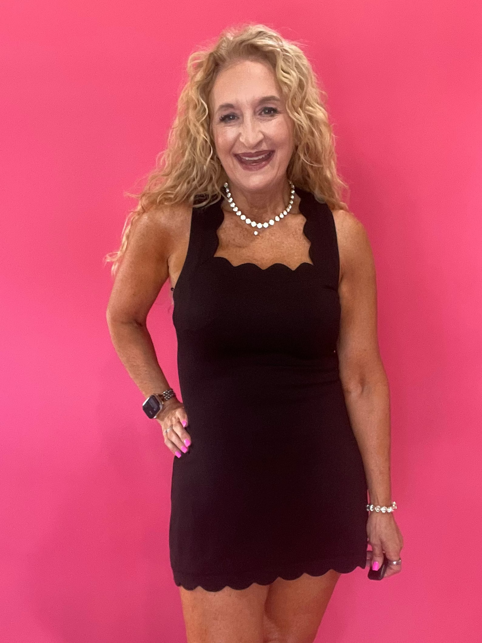 The Crossback Scallop Mini Dress in Black