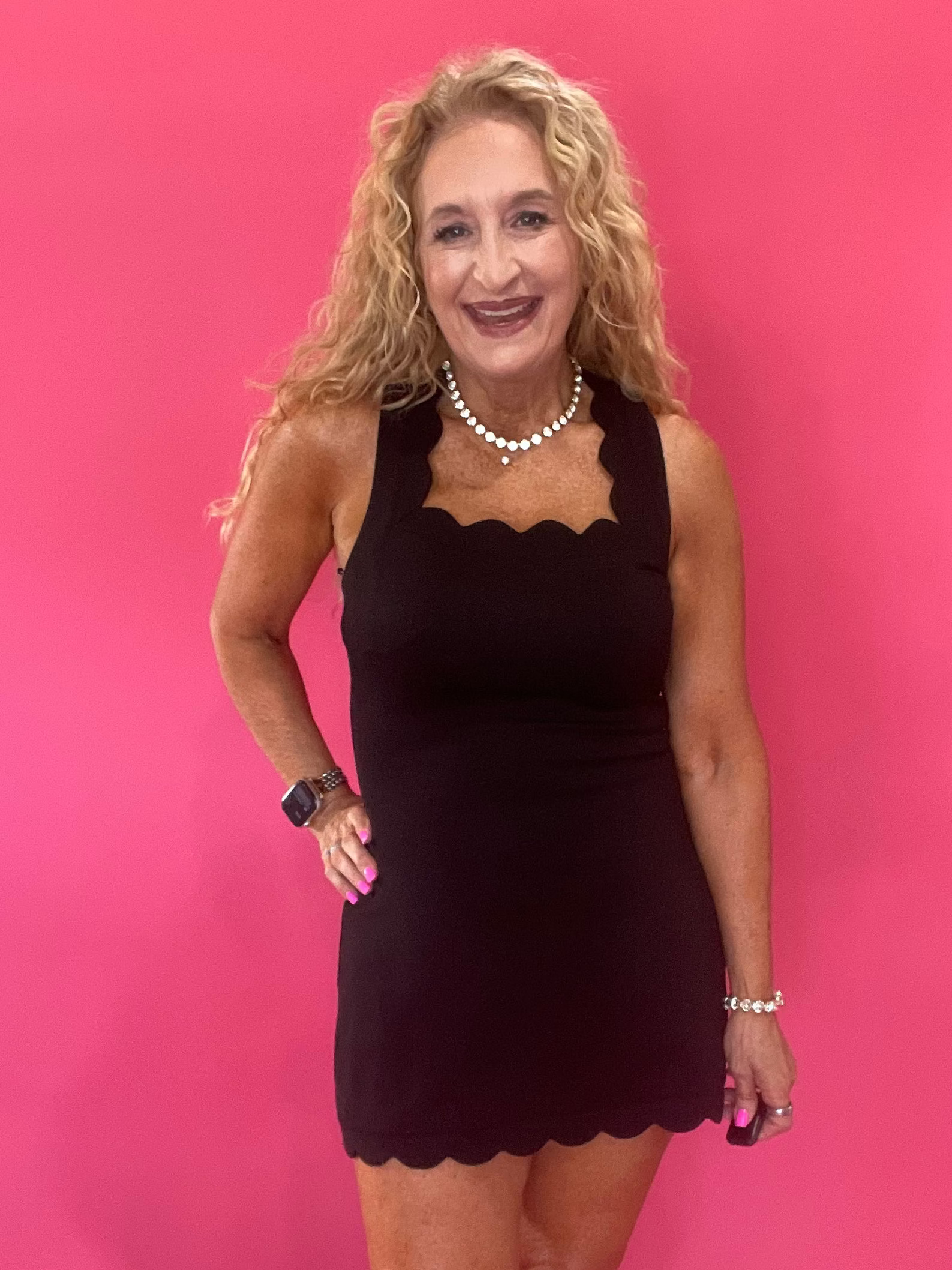 The Crossback Scallop Mini Dress in Black
