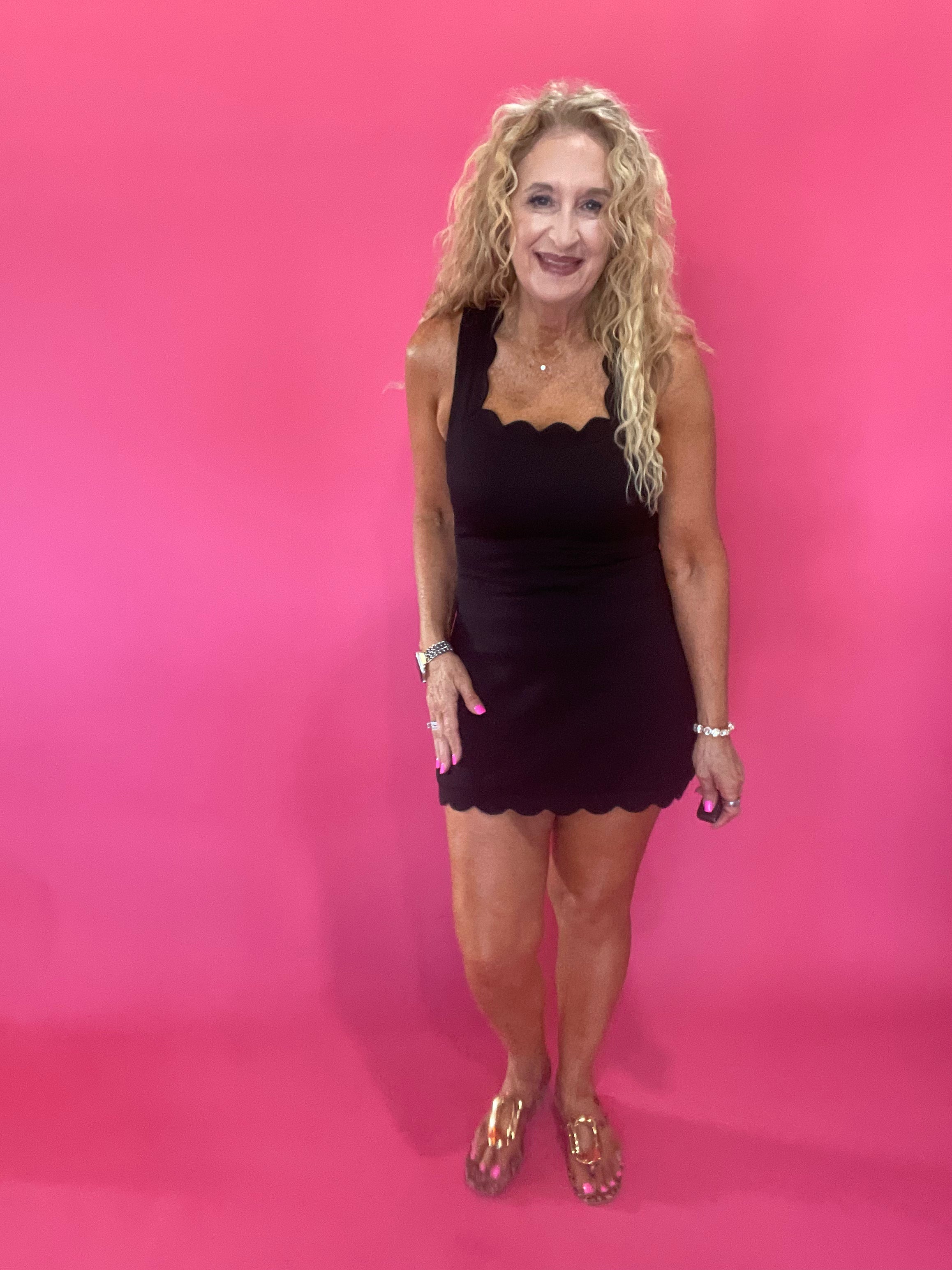 The Crossback Scallop Mini Dress in Black