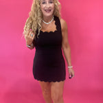 The Crossback Scallop Mini Dress in Black
