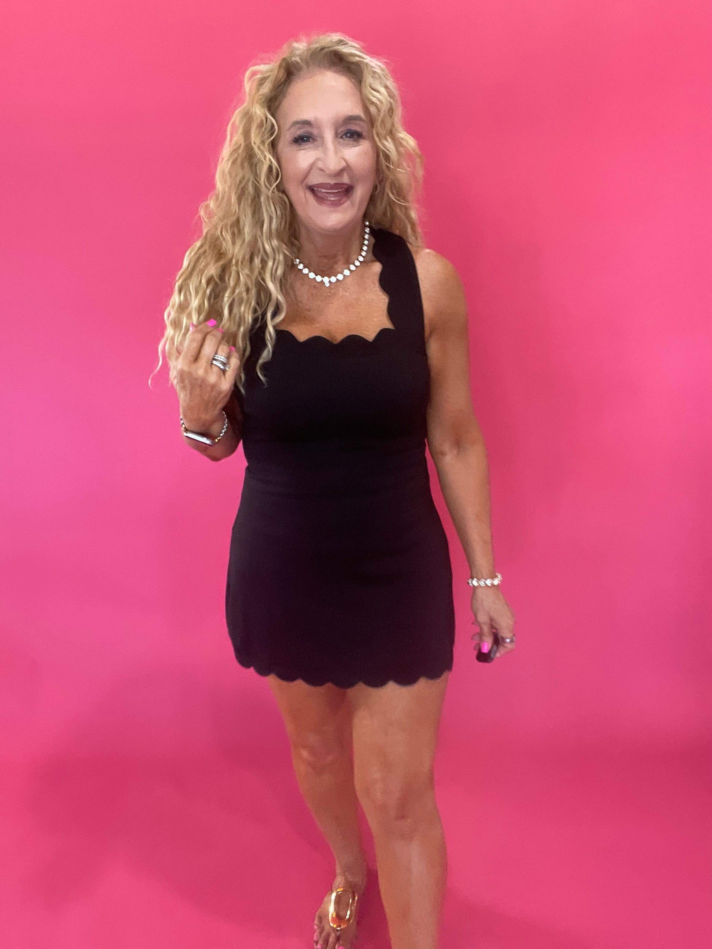 The Crossback Scallop Mini Dress in Black