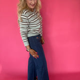 Full length view of the Curator wash wide leg stretch jeans showing the raw hem and rise