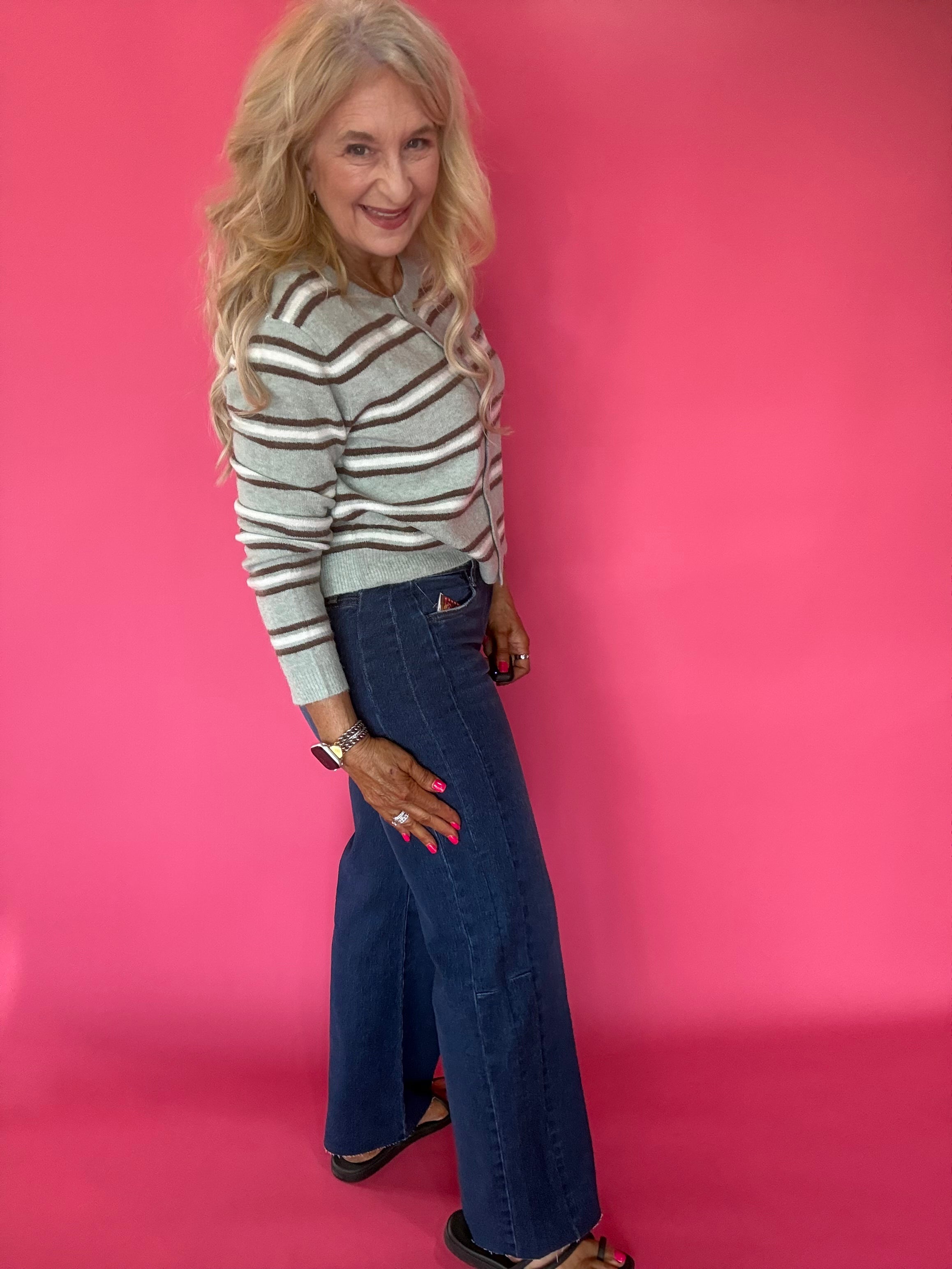 Full length view of the Curator wash wide leg stretch jeans showing the raw hem and rise