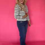 Detail of the Fab Ab front pockets smoothing the mid rise waist on the wide leg jeans