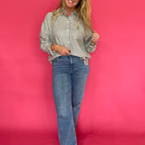 Back view of the emerald plaid shirt showing its relaxed regular fit and shirt hem
