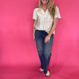 Back view of the oatmeal trapunto stitch blouse showing its easy, body-skimming silhouette
