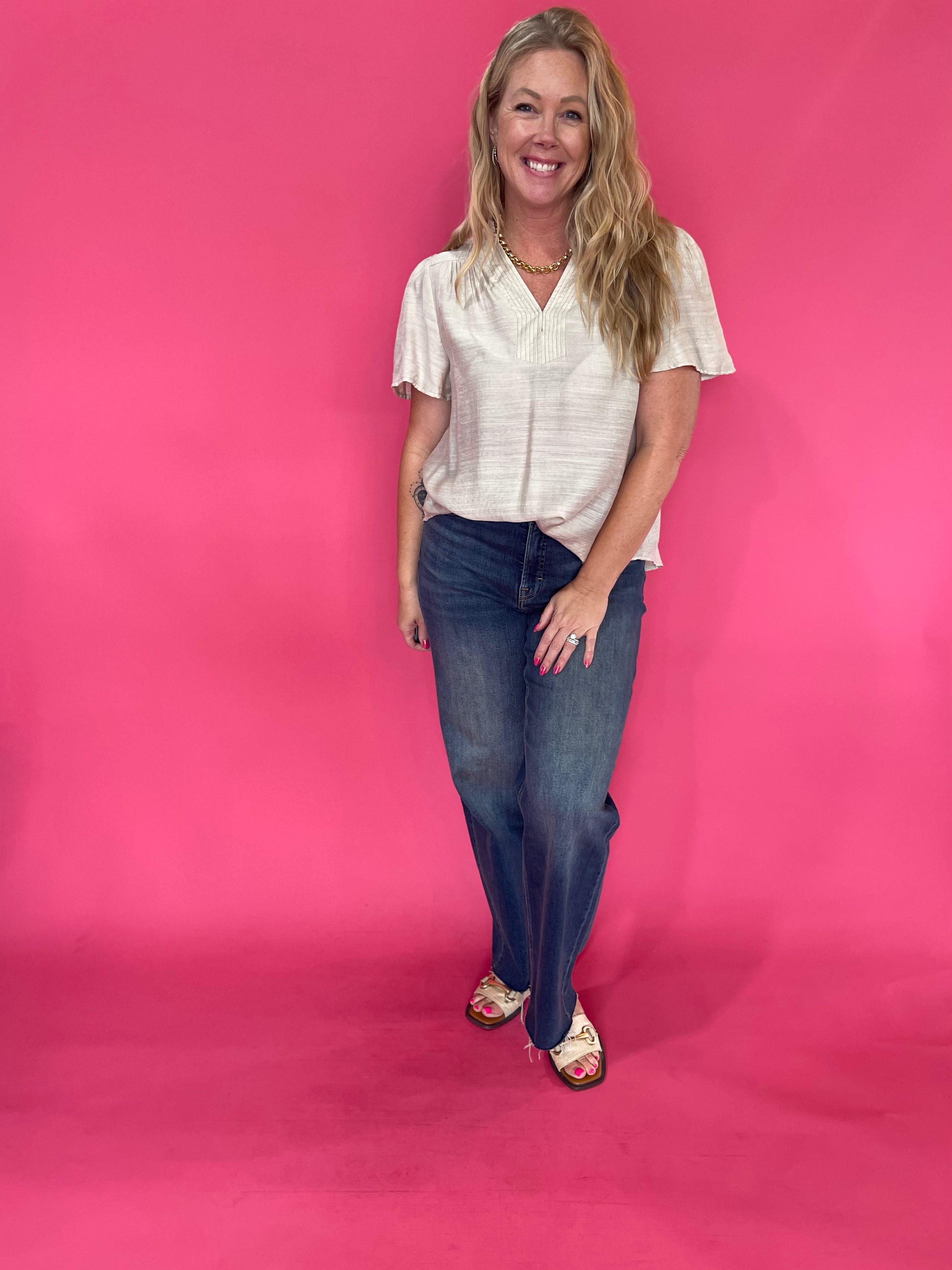 Back view of the oatmeal trapunto stitch blouse showing its easy, body-skimming silhouette