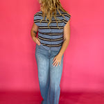 Close-up of the crisp blue and white stripe pattern on the lightweight sleeveless top
