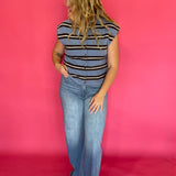 Close-up of the crisp blue and white stripe pattern on the lightweight sleeveless top