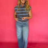 Detail of the neckline and armhole binding on the blue striped everyday sleeveless top