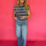 Detail of the neckline and armhole binding on the blue striped everyday sleeveless top