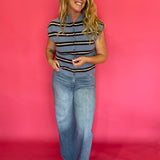 Detail of the neckline and armhole binding on the blue striped everyday sleeveless top