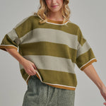 Three quarter view of the loose fit blue and brown striped sweater top styled for casual fall wear
