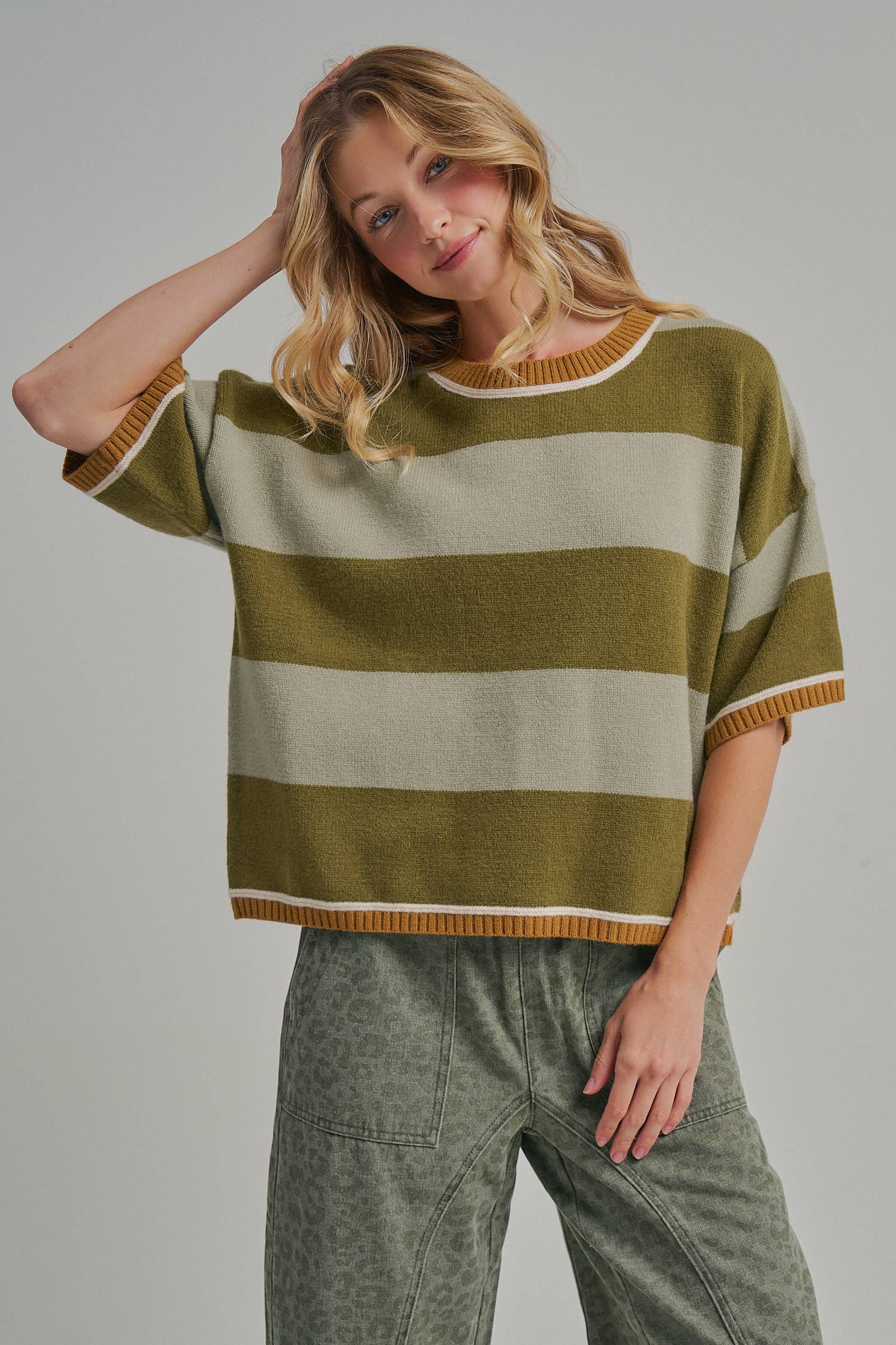 Back view of the blue and brown wide stripe sweater top showing the loose drop shoulder silhouette