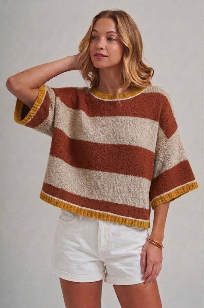 Close-up of the wide horizontal stripe pattern in blue and brown on the soft knit sweater top