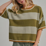 Front view of the blue and brown wide stripe sweater top worn untucked with a relaxed drape