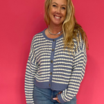 Woman wearing a chocolate brown soft knit sweater with a relaxed everyday fit and blue jeans
