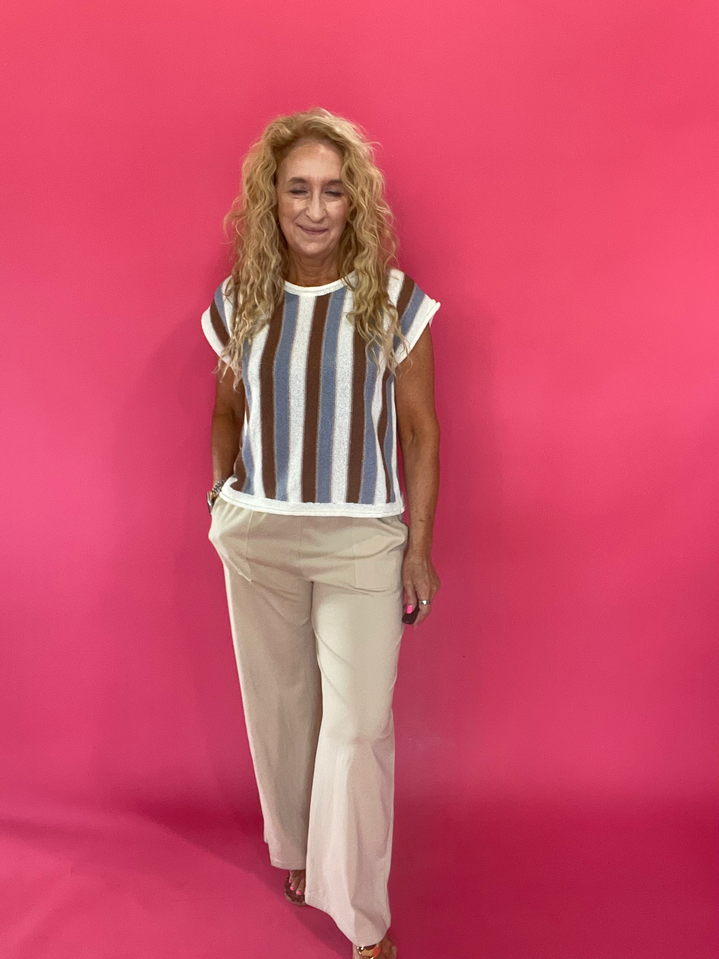 Side view of the wide leg scuba pants styled with a matching crop tee and sneakers