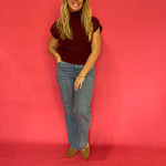 Back view of the wine red ribbed cap sleeve sweater showing the relaxed knit shape